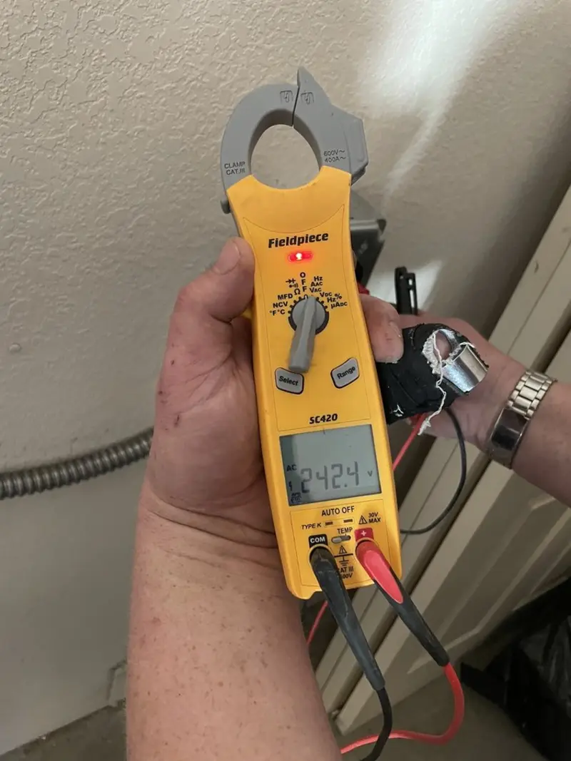 Voltage testing with clamp meter during Whole House Surge Protector in Union